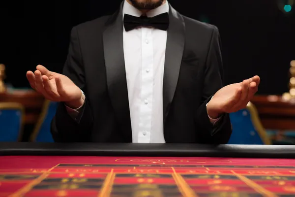 A cheerful woman in traditional clothing using her smartphone during a festive moment, showing how easily the ZS777 app fits into everyday life.